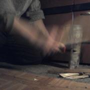 splitting a firewood to make kindling