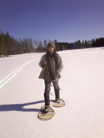 Sami walking with his snowshoes